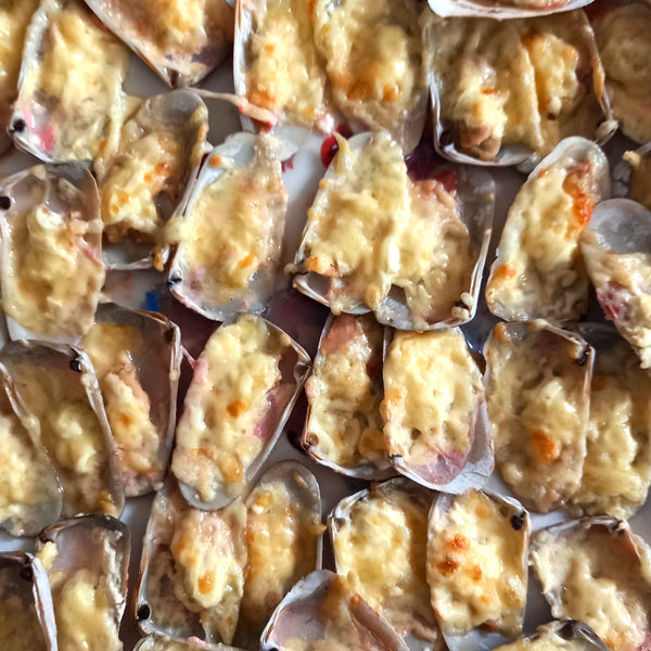 Machas a la parmesana cocinadas